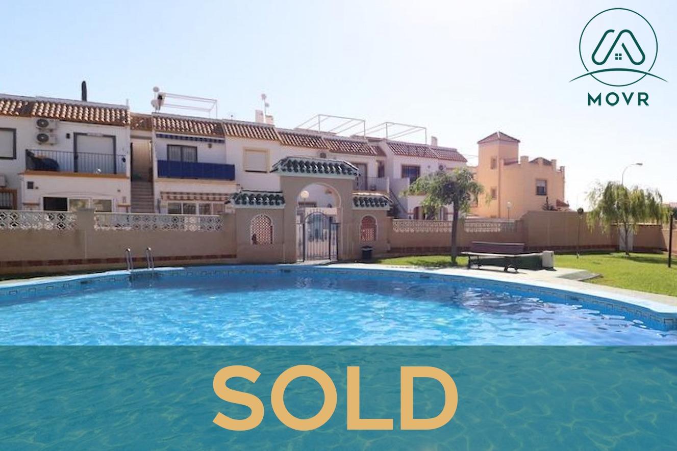 Townhouses set around a gated communal pool previously sold by MOVR in Orihuela Costa