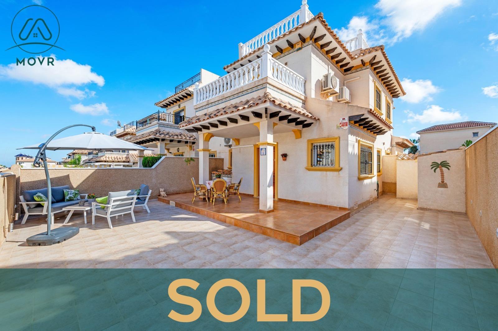 Detached villa with a large tiled terrace and shaded seating previously sold by MOVR in Orihuela Costa