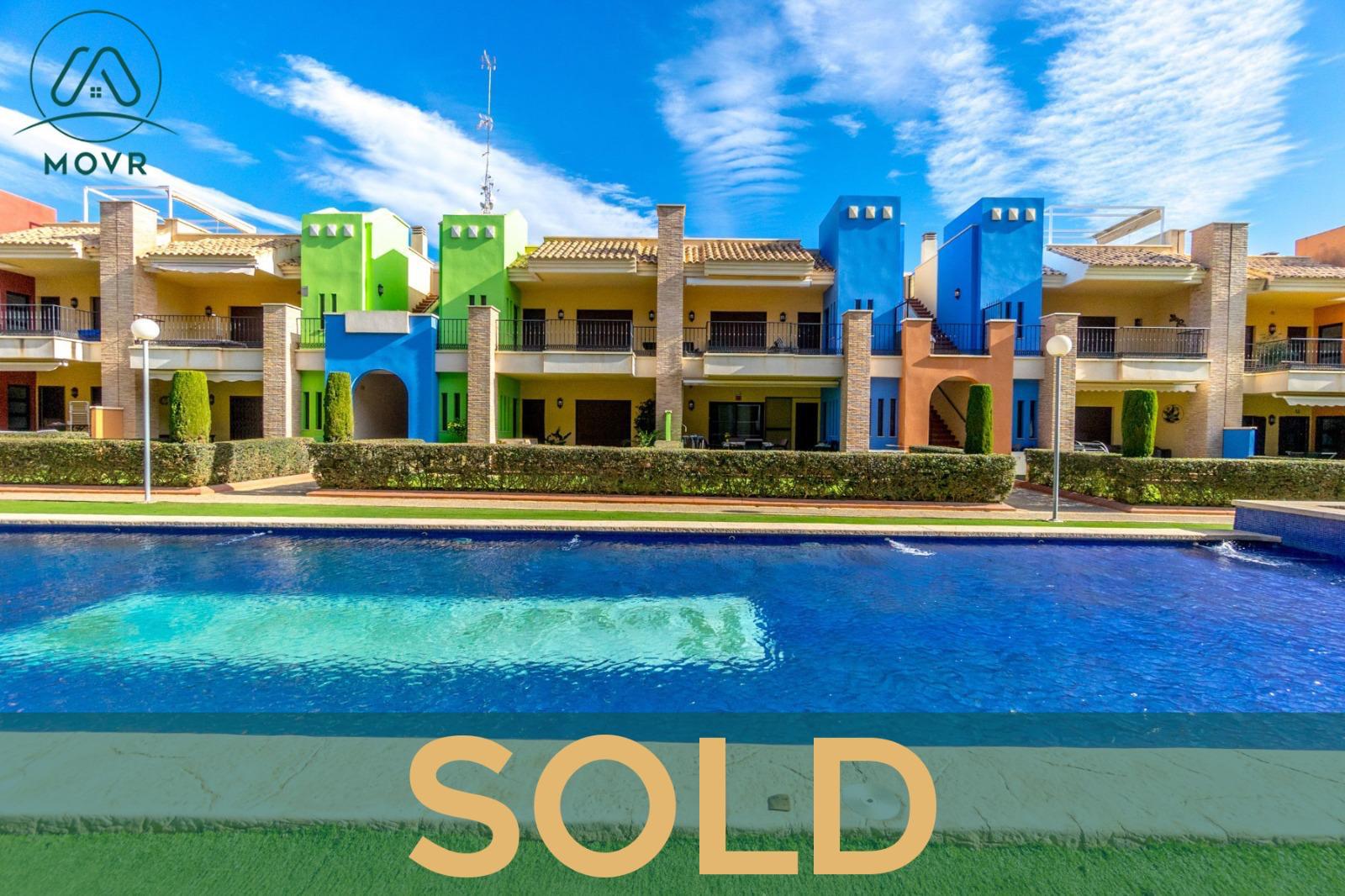 Apartments overlooking a large communal pool previously sold by MOVR in Orihuela Costa