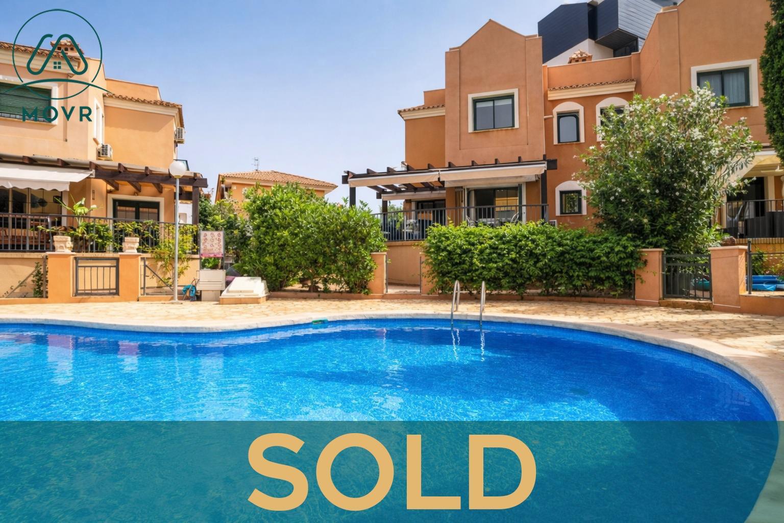 Townhouse overlooking a communal pool previously sold by MOVR in Torrevieja
