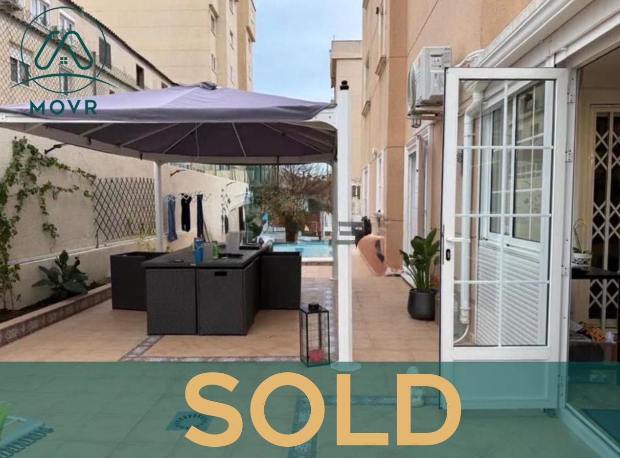 Private patio with shaded seating previously sold by MOVR in Orihuela Costa