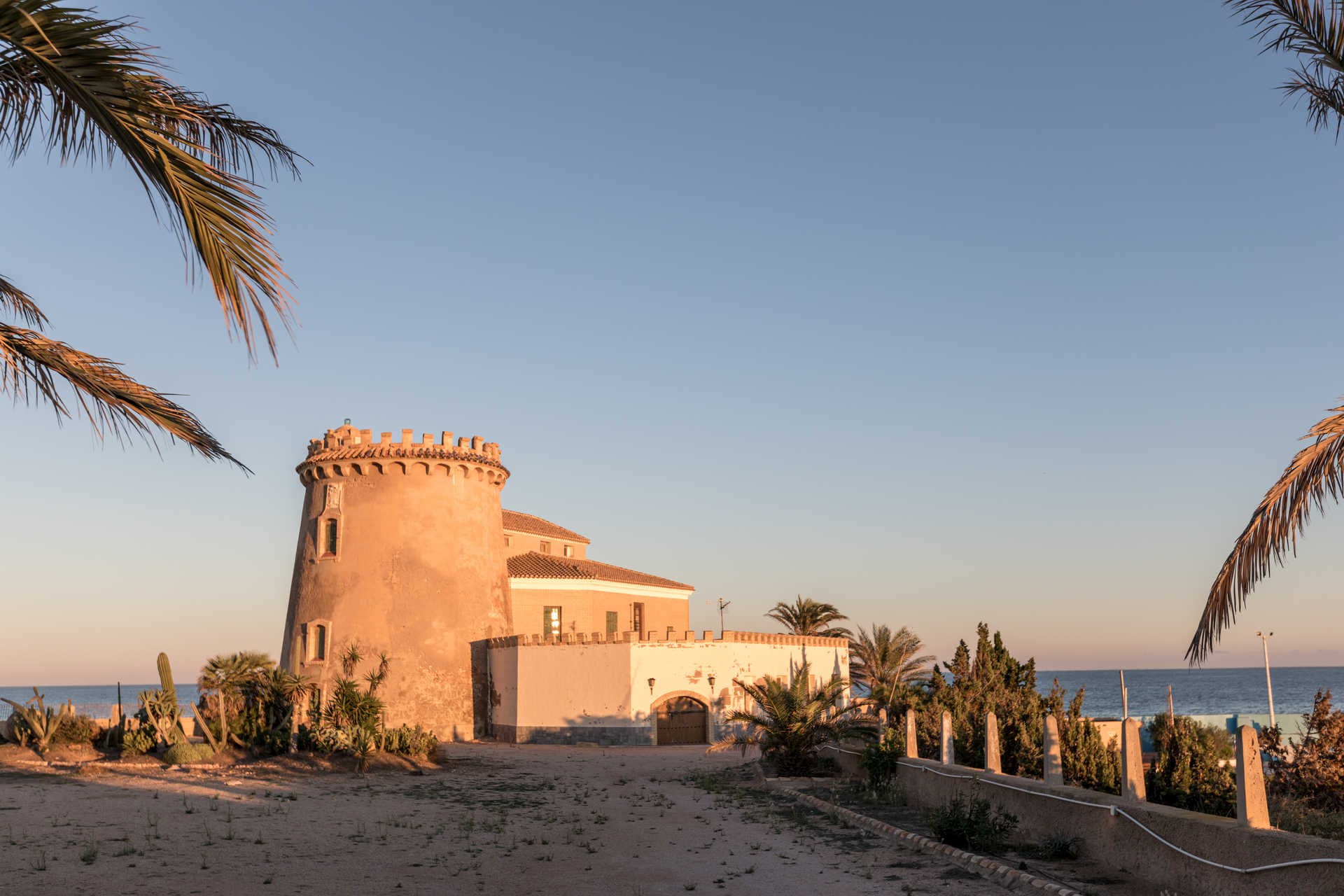 Torre Vigía watchtower at golden hour above the Torre de la Horadada beach